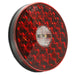 Red round reflective safety light on a white background