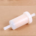 Two white plastic filters on a beige background