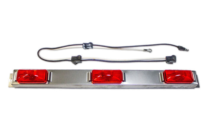 Tail light assembly with red lenses and wiring on a white background